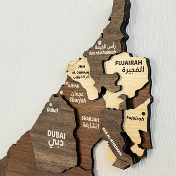 Close-up of the UAE wooden wall map showing Dubai, Sharjah, Ajman, Fujairah and Ras Al-Khaimah in layered wood