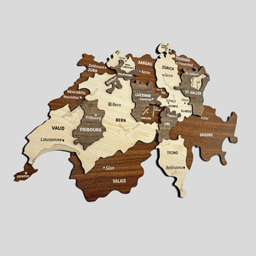 Switzerland wooden wall map from an angle, with Vaud, Bern, Valais and Ticino labels visible