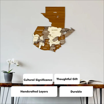 Wooden Guatemala map above a desk with four badges: cultural significance, thoughtful gift, handcrafted layers, durable