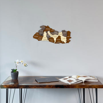 El Salvador wooden map above a resin edge desk with a laptop, mid-distance view