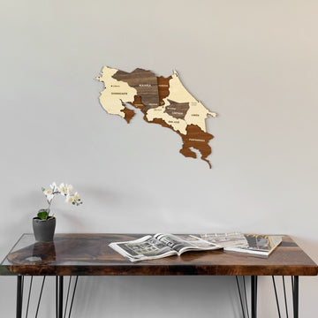 Costa Rica wooden wall map above a resin desk with an orchid, seen from a lower angle