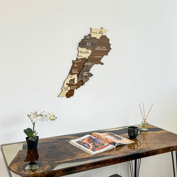 Lebanon wooden wall map above the corner of a desk with an open magazine