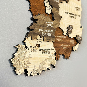 Close-up of the southern half of the Korea wooden wall map showing Jeonju, Muan and Busan labels in layered wood