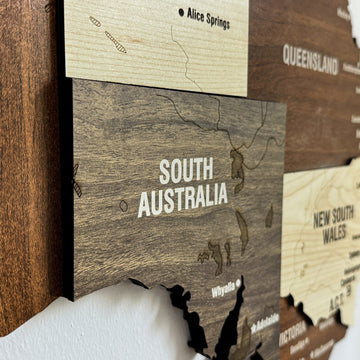 Angled close-up of the wooden Australia map showing South Australia, Northern Territory and New South Wales layers