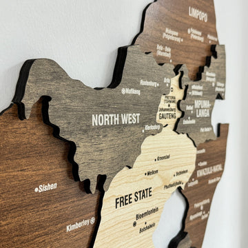 Close-up of South Africa wooden map layers showing North West, Gauteng, Free State and Mpumalanga panels