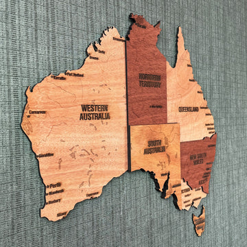 Close-up angled view of Western Australia, Northern Territory and Queensland on the wooden map