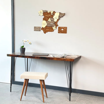 Mixed color Spain wooden wall map above a desk with a cream stool, closer room view