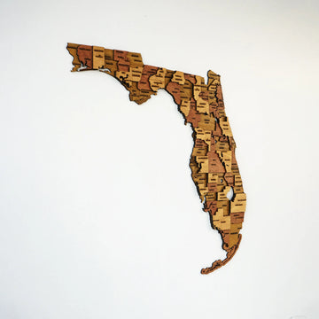 Full-frame view of the 3D wooden Florida map from the panhandle to the Keys with county names engraved