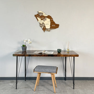Saudi Arabia wooden wall map with region names high above a resin desk, wide view
