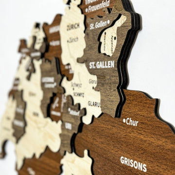 Close-up from the side of the Switzerland wooden map showing St. Gallen, Uri, Glarus and Grisons layers
