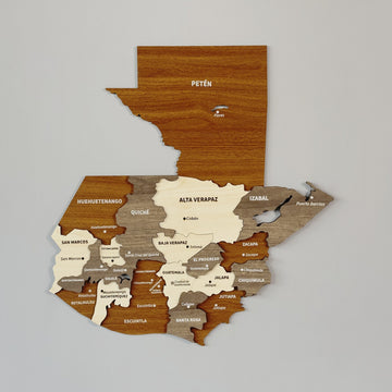 Multicolor 3D wooden Guatemala wall map with Petén in brown and department labels, front view on a gray wall