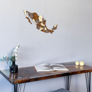 Mexico wooden wall map above a resin desk with an open book, close view from the left