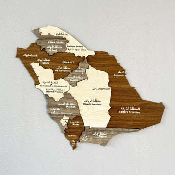 Saudi Arabia wooden wall map with Arabic and English region names in brown and beige wood, on a gray wall