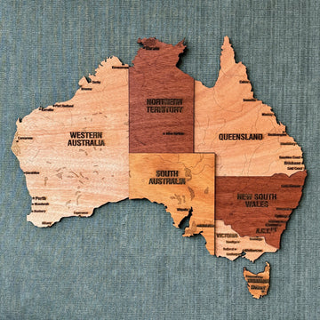 Wooden Australia wall map with state names in mahogany and light plywood layers, front view