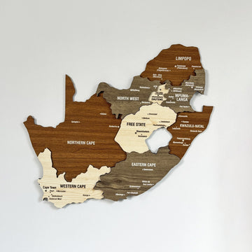 South Africa wooden wall map with province names in brown, gray and cream wood, straight-on on a gray wall