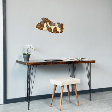 El Salvador wooden map above a console table with a cream stool, wide room view