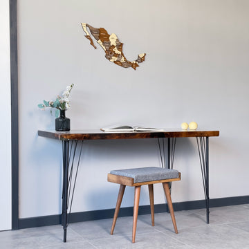 Small Mexico wooden wall map above a desk with a stool, wide view