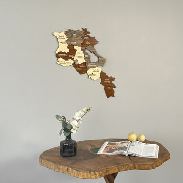 Armenia wooden wall map above a wooden table top with two pears