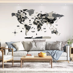 Grey wooden world map in black, gray and cream layers above a sofa with a wooden coffee table, wide view