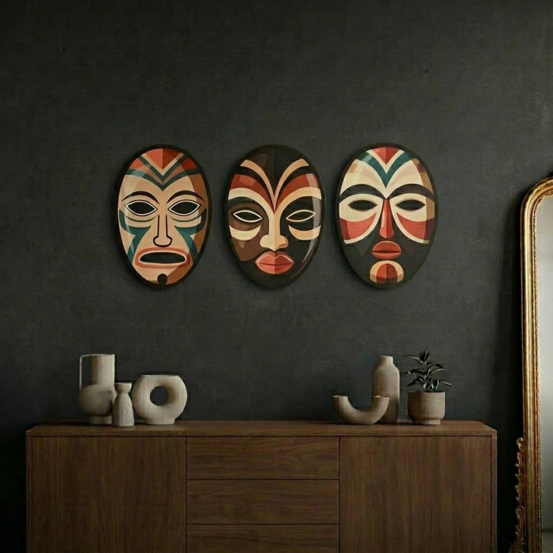 African masks metal wall art set on a dark wall above a wooden console