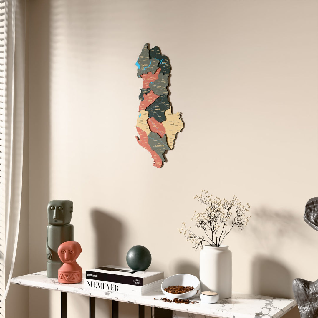 Sage Albania wooden wall map beside a sheer curtain, angled view