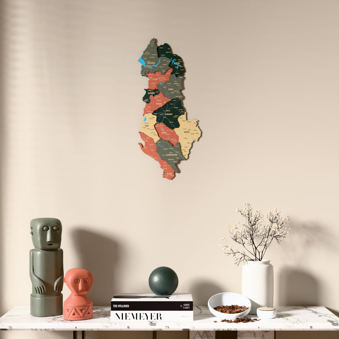 Sage Albania wooden wall map above a marble console, front view