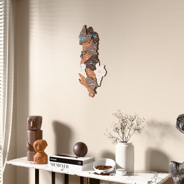 Soil Albania wooden wall map beside a sheer curtain, angled view