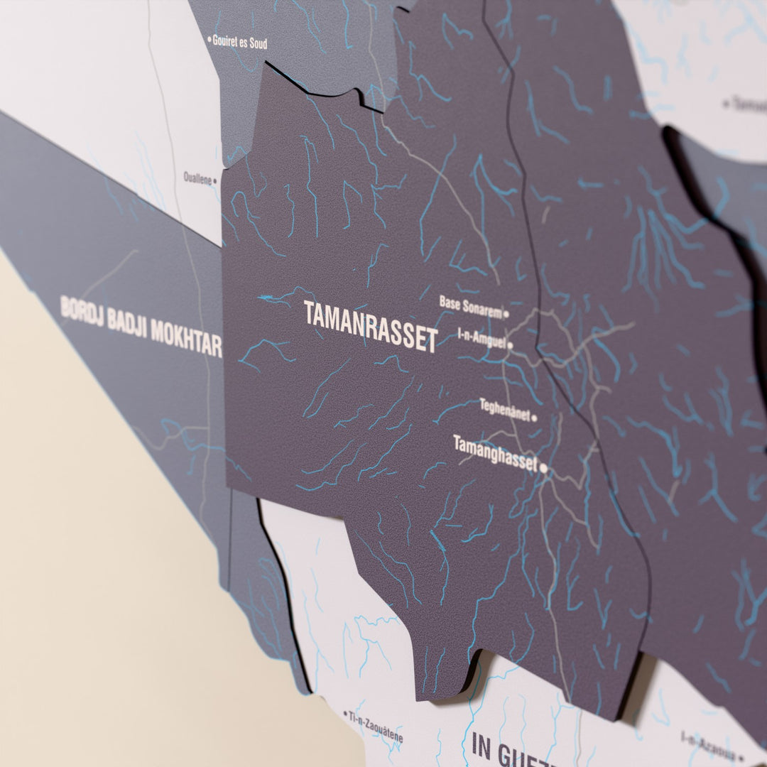 Close-up of the Nimbus Algeria wooden wall map with layered regions and printed names