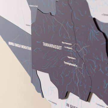 Close-up of the Nimbus Algeria wooden wall map with layered regions and printed names