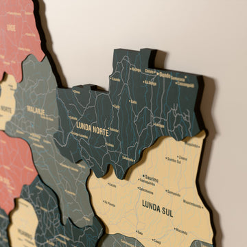 Close-up of the Sage Angola wooden wall map with layered regions and printed names