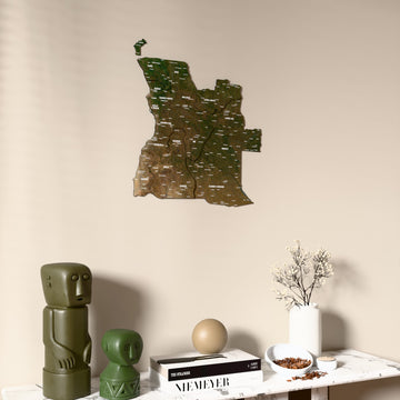 Satellite Angola wooden wall map on a beige wall above a console with figurines