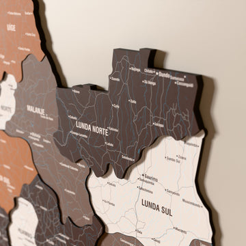 Close-up of the Soil Angola wooden wall map with layered regions and printed names