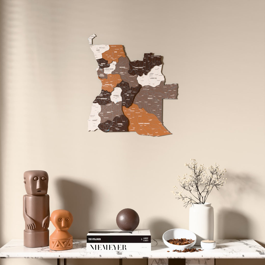 Soil Angola wooden wall map above a marble console, front view