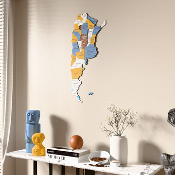 Flag colored Argentina wooden wall map beside a sheer curtain, angled view