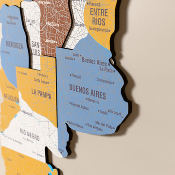 Close-up of the Flag colored Argentina wooden wall map with layered regions and printed names