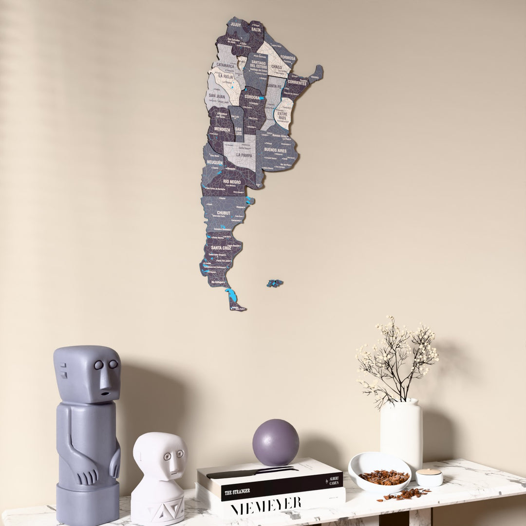 Nimbus Argentina wooden wall map on a beige wall above a console with figurines