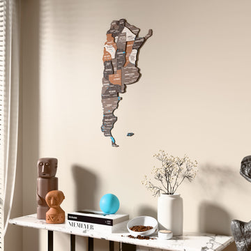 Soil Argentina wooden wall map beside a sheer curtain, angled view