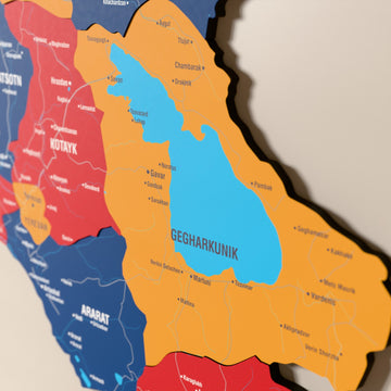 Close-up of the Flag colored Armenia wooden wall map with layered regions and printed names