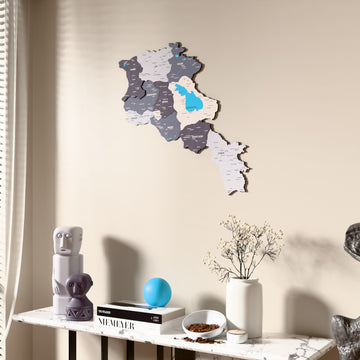 Nimbus Armenia wooden wall map beside a sheer curtain, angled view