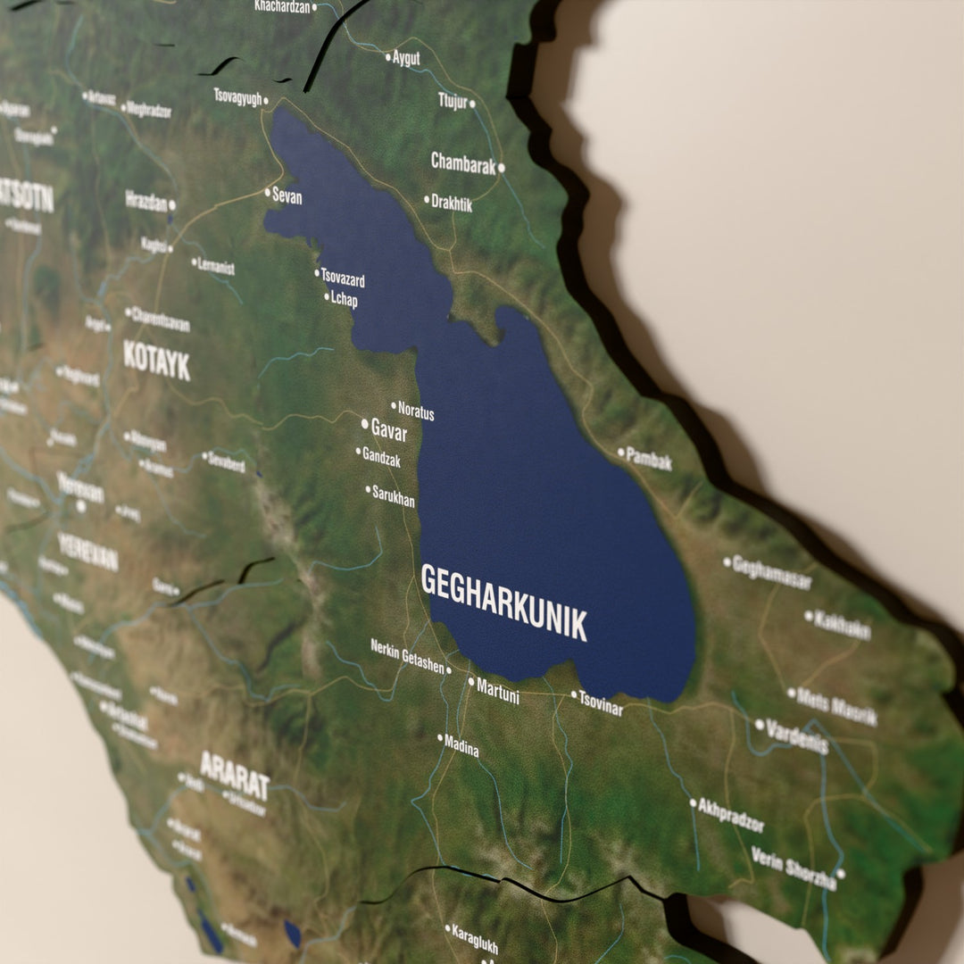 Close-up of the Satellite Armenia wooden wall map with layered regions and printed names