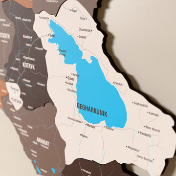 Close-up of the Soil Armenia wooden wall map with layered regions and printed names