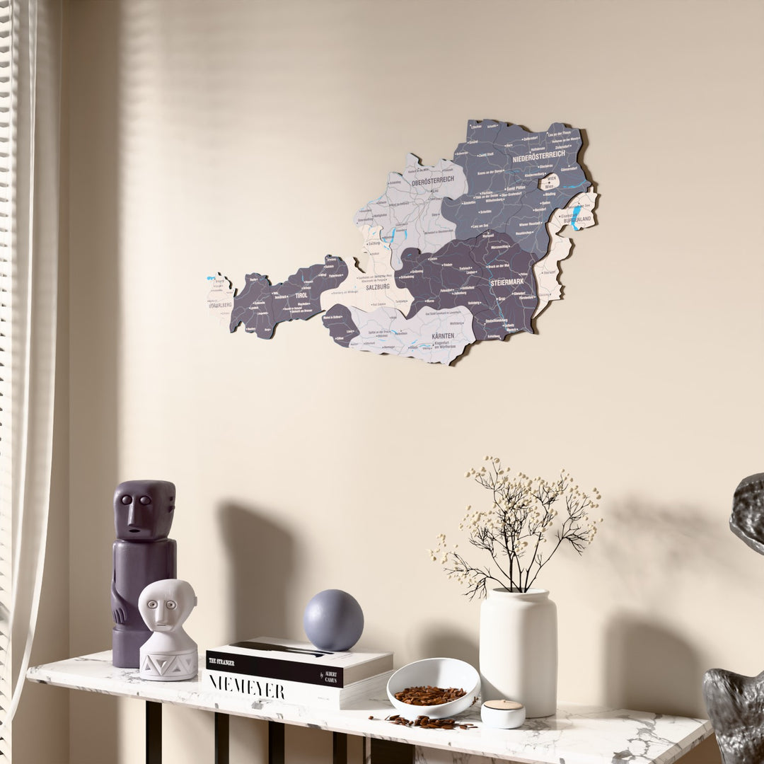 Nimbus Austria wooden wall map beside a sheer curtain, angled view