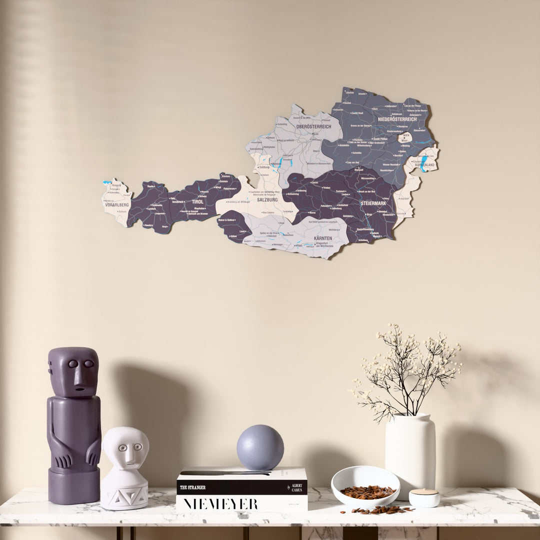 Nimbus Austria wooden wall map above a marble console, front view