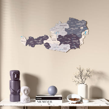 Nimbus Austria wooden wall map above a marble console, front view