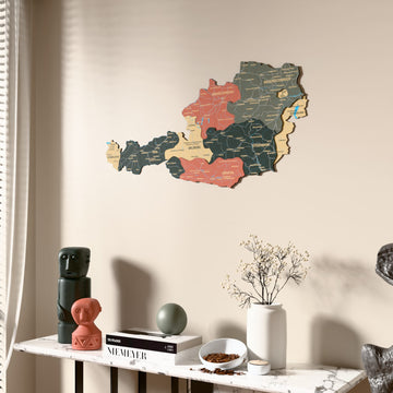 Sage Austria wooden wall map beside a sheer curtain, angled view