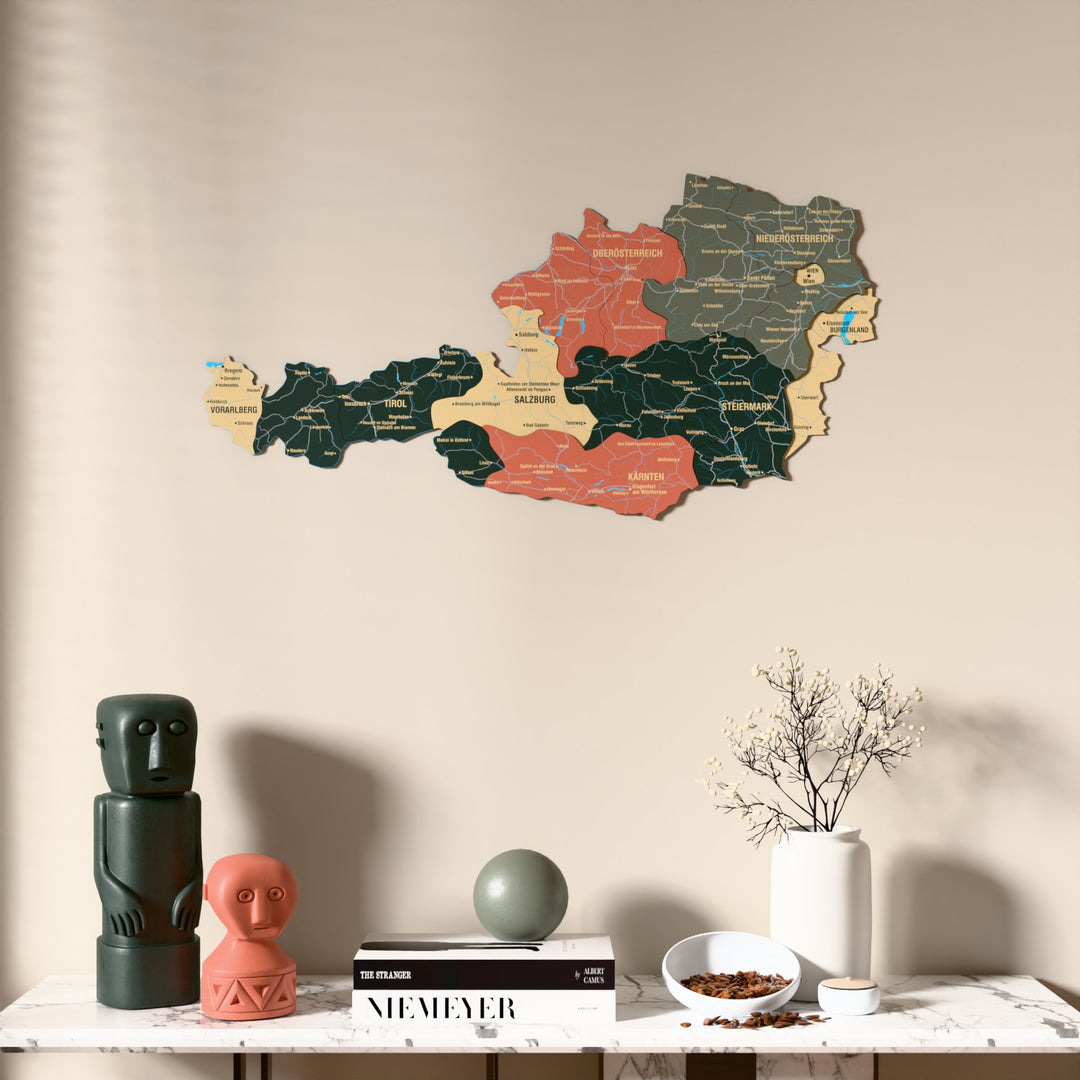 Sage Austria wooden wall map above a marble console, front view