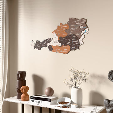 Soil Austria wooden wall map beside a sheer curtain, angled view