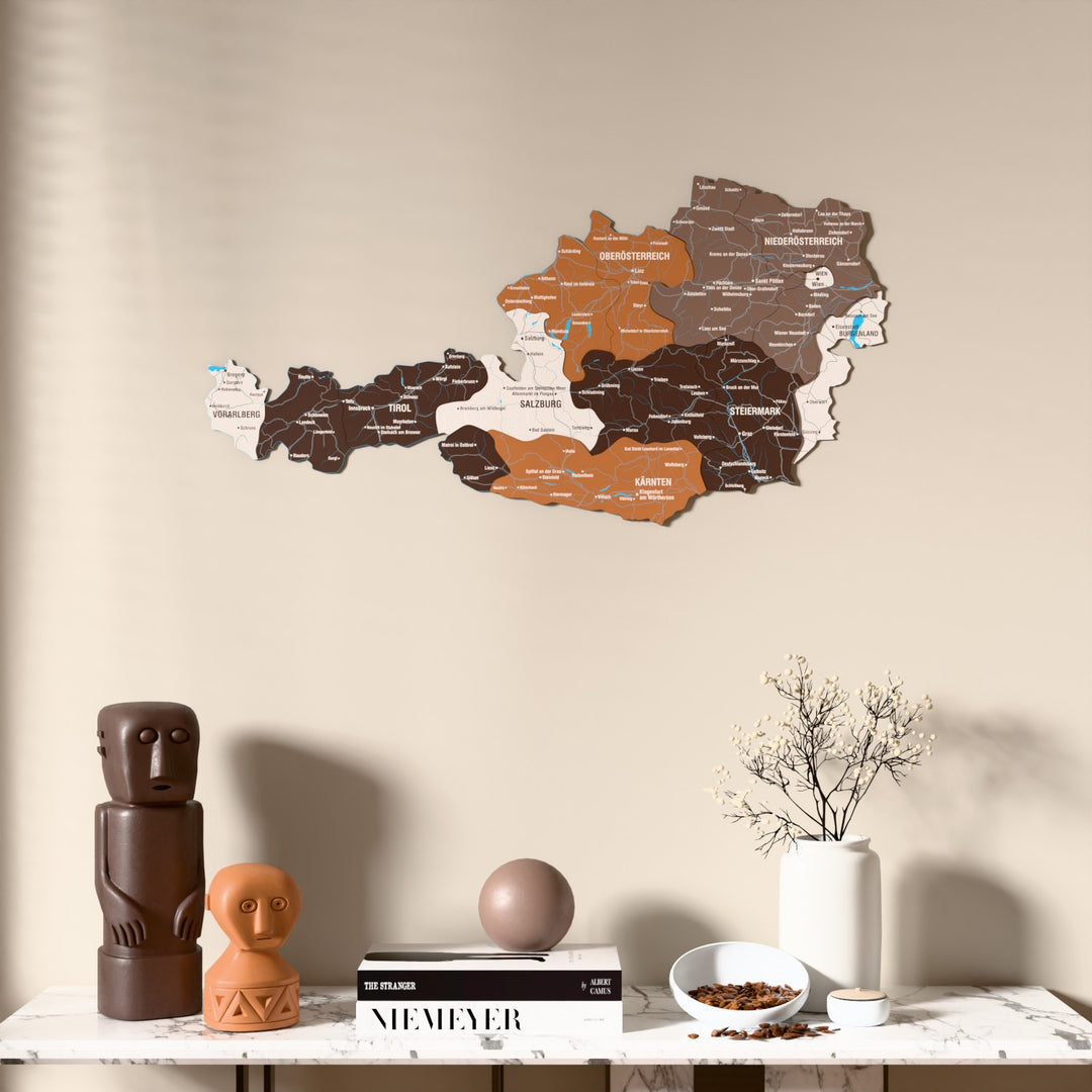 Soil Austria wooden wall map above a marble console, front view