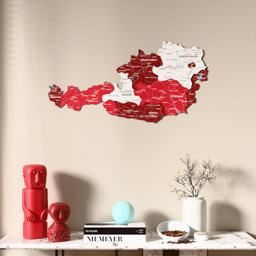 Flag colored Austria wooden wall map above a marble console, front view