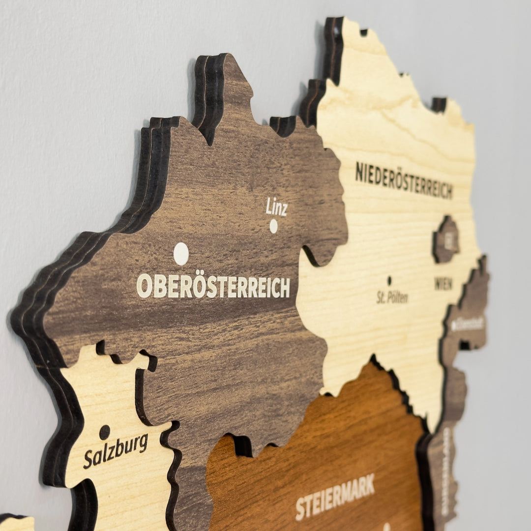 Close-up of Austria wooden map layers showing Oberosterreich, Niederosterreich, Salzburg and Steiermark